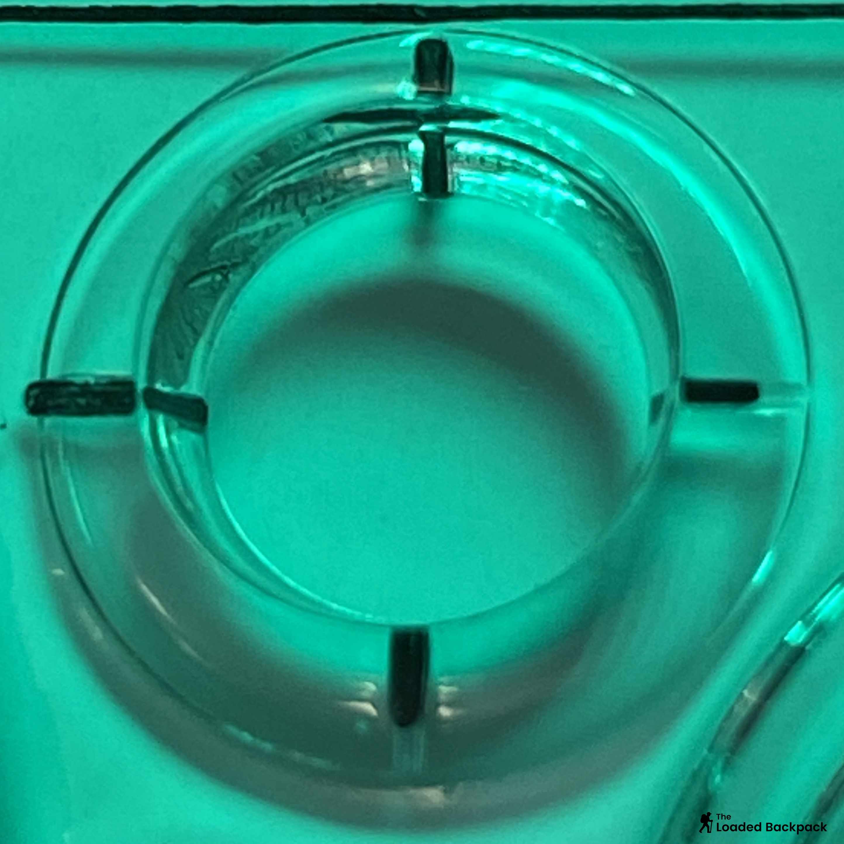 Cut-outs on a baseplate compass for drawing circles or marking route legs.